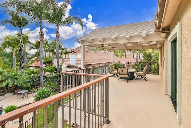 balcony with a pergola and a patio