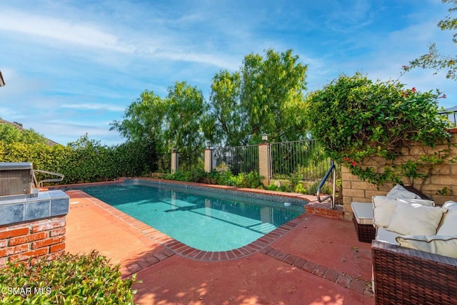 view of pool featuring cooling unit, an outdoor living space, and a patio area