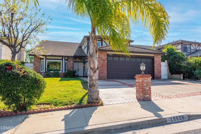 view of front of property with a garage and a front yard