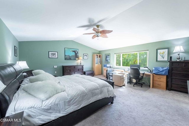 bedroom featuring light carpet, vaulted ceiling, and ceiling fan