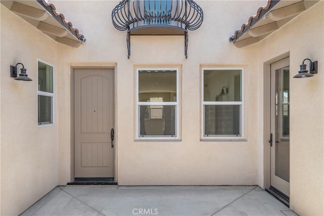 property entrance with a patio area