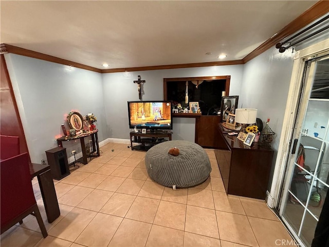 sitting room featuring ornamental molding and light tile patterned floors