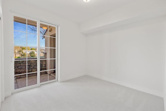 unfurnished room featuring carpet flooring