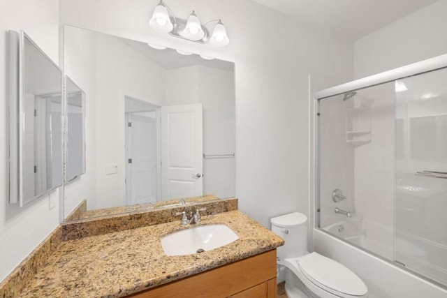 full bathroom featuring bath / shower combo with glass door, vanity, and toilet