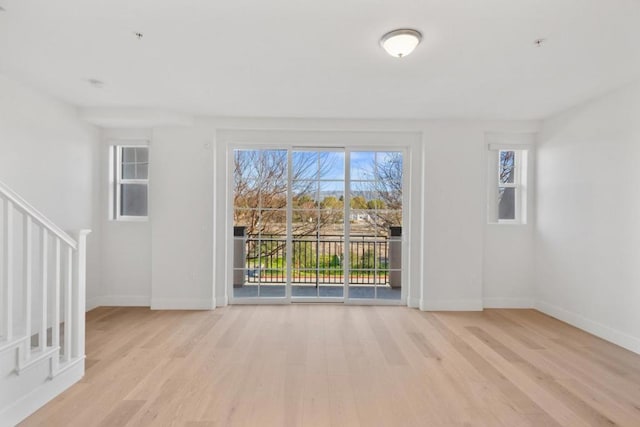 unfurnished living room with light hardwood / wood-style floors