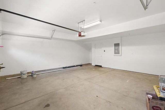 garage featuring a garage door opener and electric panel