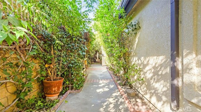 view of property exterior with a patio area