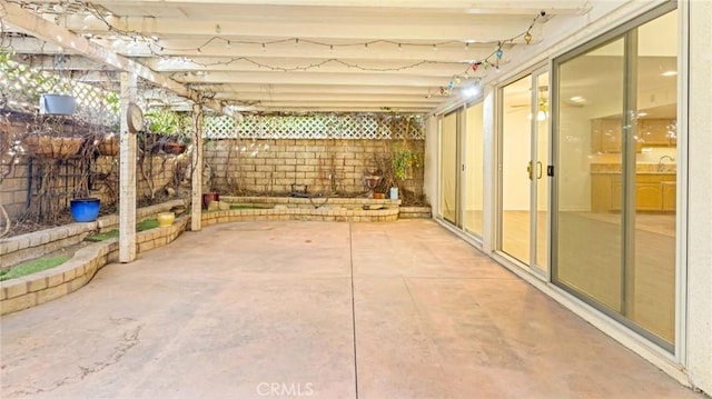 view of patio with a fenced backyard and a sink