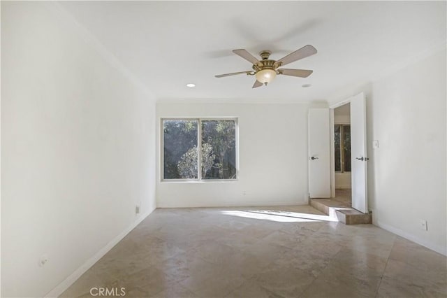 empty room with baseboards, ornamental molding, and a ceiling fan