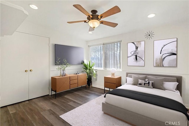 bedroom with dark wood finished floors, a ceiling fan, and recessed lighting