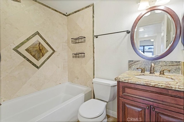 bathroom featuring toilet, washtub / shower combination, and vanity