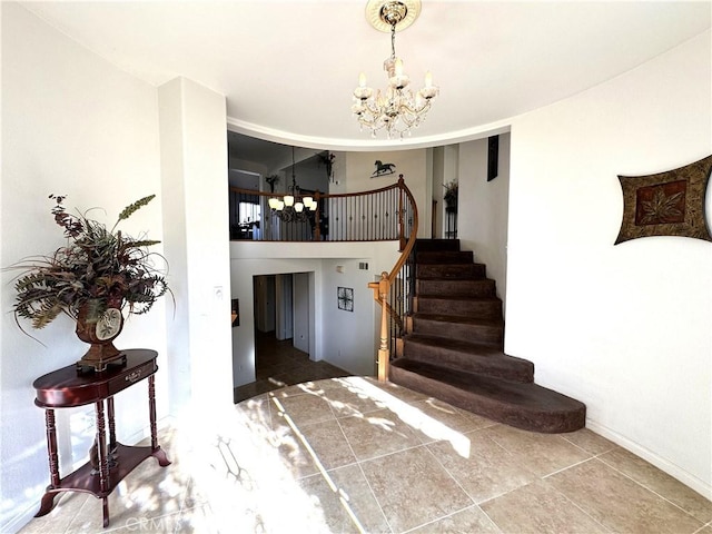 stairs with a chandelier