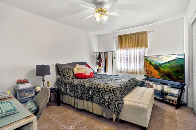 tiled bedroom with ceiling fan