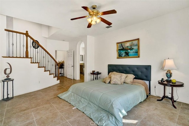 bedroom with light tile patterned floors and ceiling fan