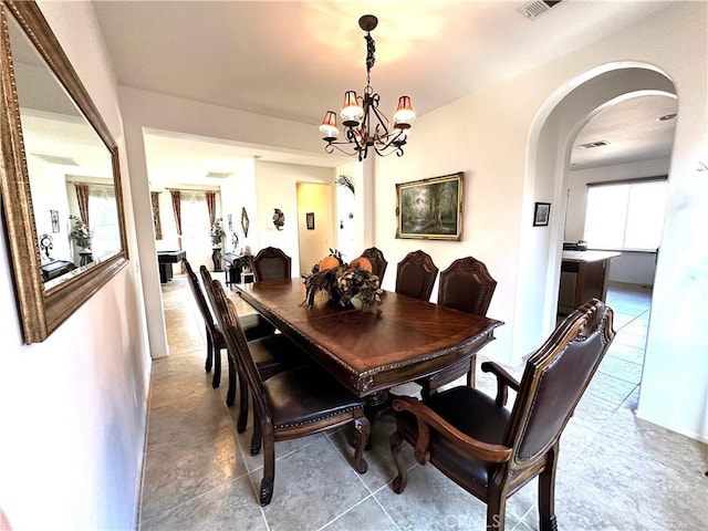 dining room featuring a chandelier