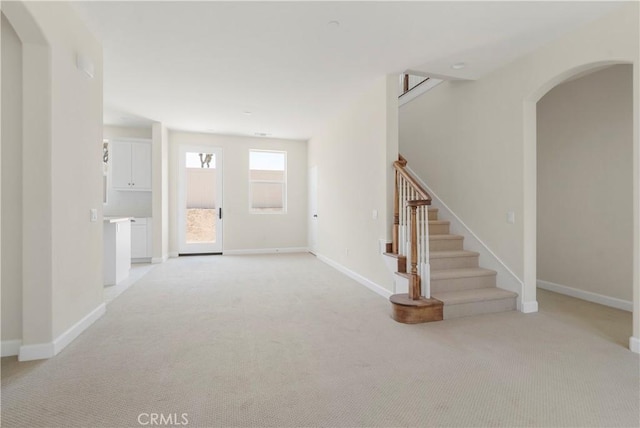 entrance foyer with light colored carpet