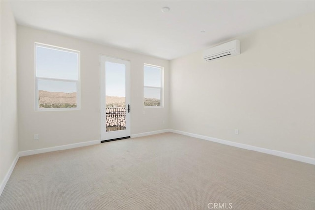 carpeted empty room featuring a wall mounted AC