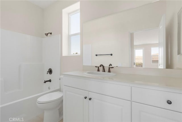 full bathroom with vanity, bathtub / shower combination, and toilet