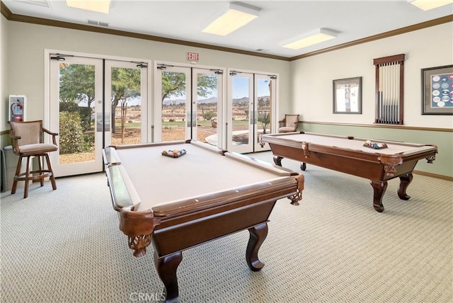 rec room with pool table, ornamental molding, and light colored carpet