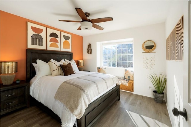 bedroom with hardwood / wood-style flooring and ceiling fan