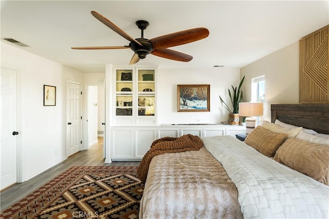 bedroom featuring light hardwood / wood-style floors and ceiling fan