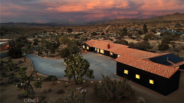 aerial view at dusk with a mountain view