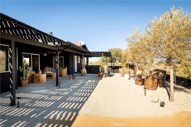 view of patio / terrace with a jacuzzi, outdoor lounge area, and a pergola