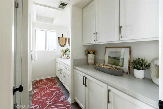 bar featuring white cabinetry