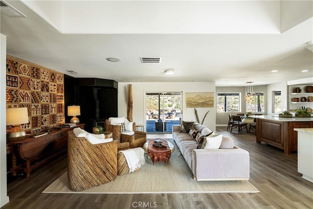 living room with hardwood / wood-style floors and built in features