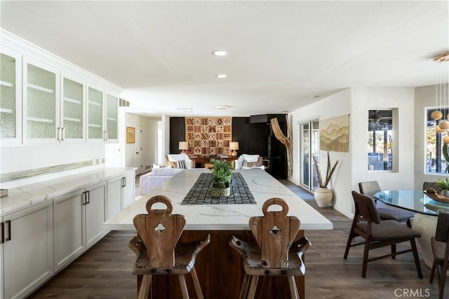 dining room with dark hardwood / wood-style flooring