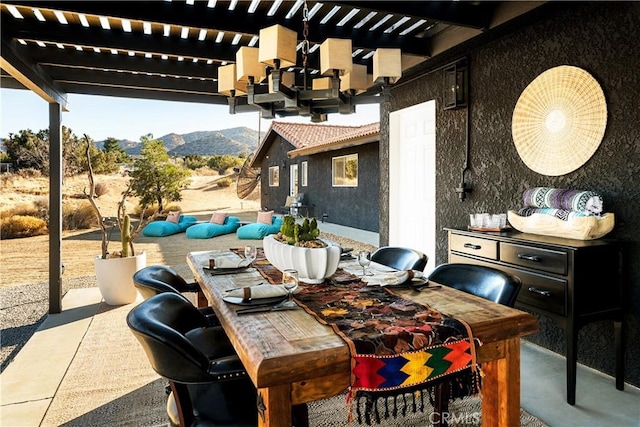 view of patio featuring a mountain view and a pergola