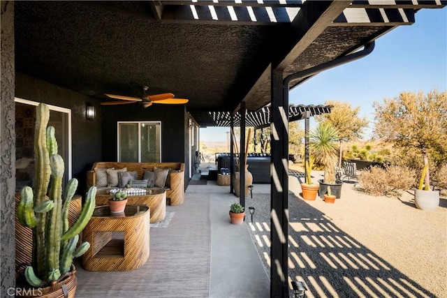 view of patio with outdoor lounge area and ceiling fan