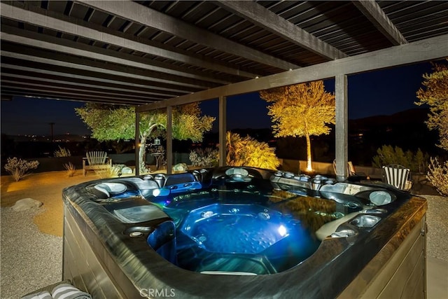 pool at twilight with a hot tub