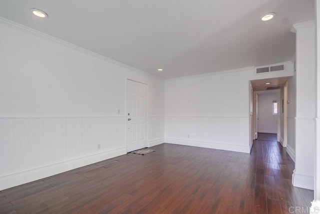 unfurnished room featuring crown molding and dark hardwood / wood-style floors