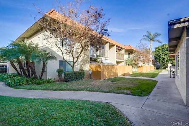 view of side of property featuring a yard