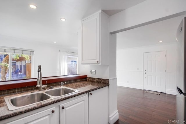 kitchen with sink, white cabinets, and dark hardwood / wood-style flooring