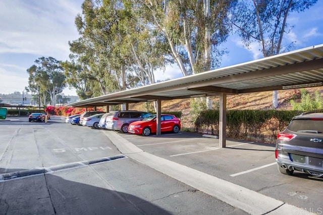 view of parking / parking lot with a carport