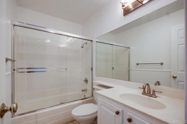 full bathroom featuring shower / bath combination with glass door, vanity, and toilet