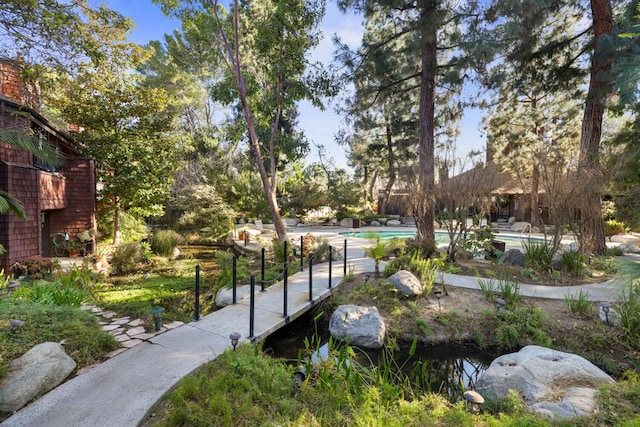 view of property's community featuring a pool