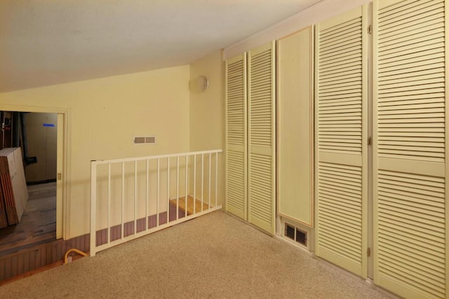 unfurnished bedroom featuring light carpet