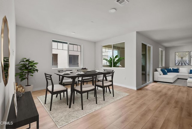 dining area with light wood-type flooring