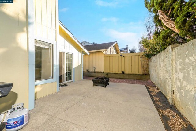 view of patio / terrace with an outdoor fire pit