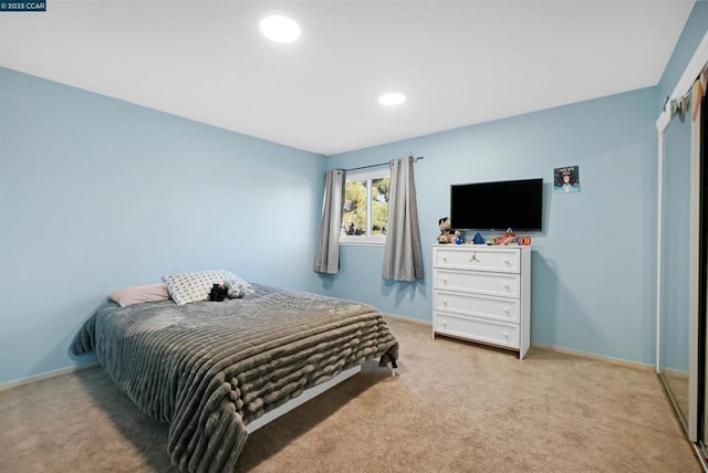 bedroom with light colored carpet