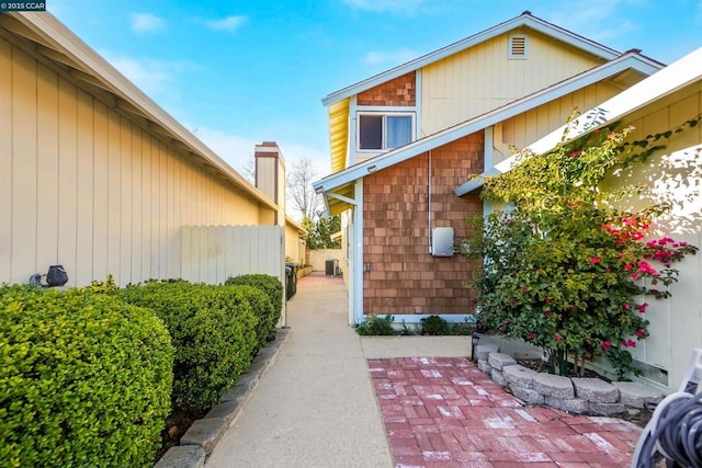 view of side of property with a patio