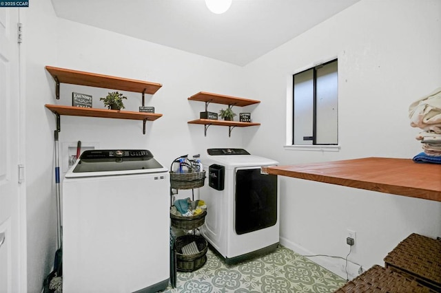 laundry room featuring washer and clothes dryer