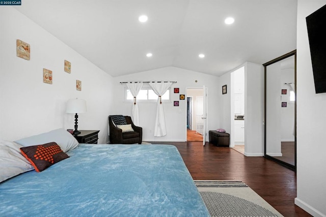 bedroom featuring vaulted ceiling and dark hardwood / wood-style floors