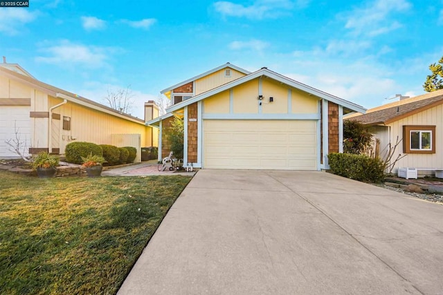 ranch-style home featuring a garage and a front yard