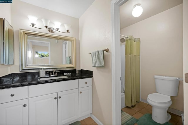 full bathroom featuring toilet, tile patterned floors, shower / bathtub combination with curtain, and vanity