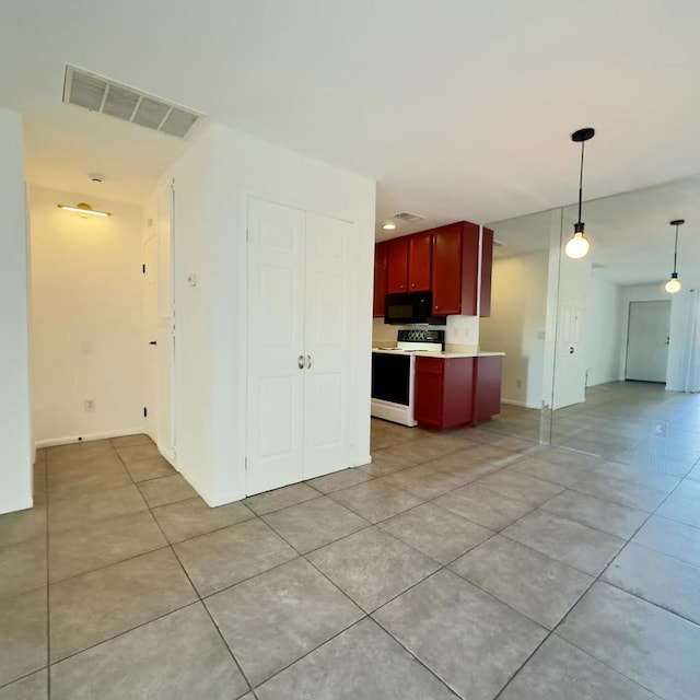 kitchen with range with electric stovetop, hanging light fixtures, and light tile patterned floors