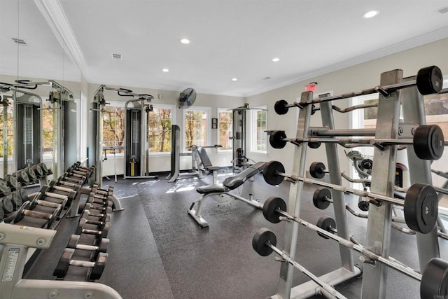 workout area featuring ornamental molding